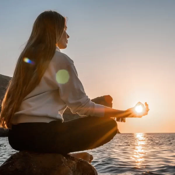 young-woman-with-long-hair-sportswear-boho-style-braclets-practicing-outdoors-yoga-mat-by